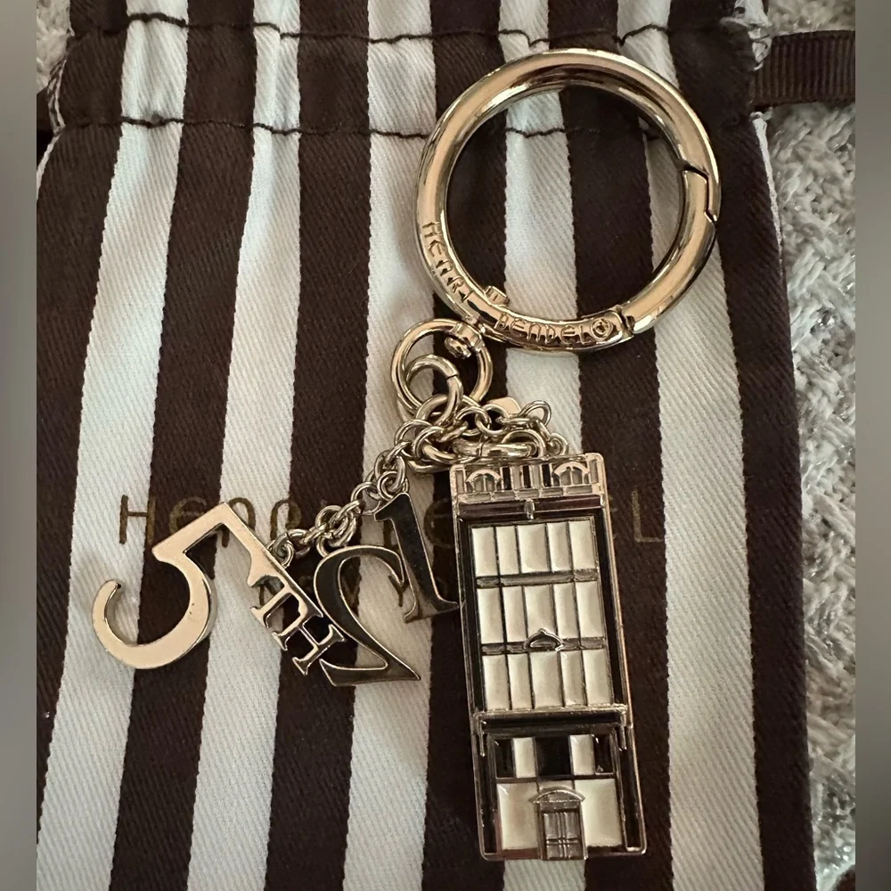 Gorgeous Henri Bendel Iconic 712  5th Avenue Gold Keychain Fob Bag Charm VGUC